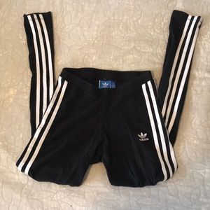 Small Adidas black & 3 white stripped leggings.
